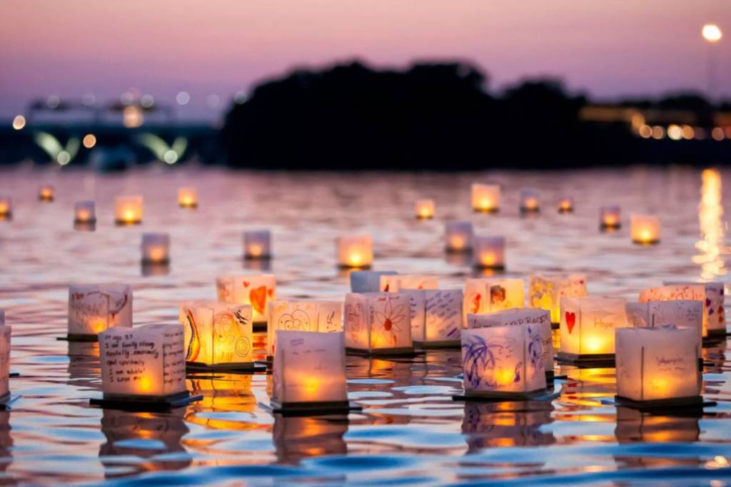 At the Water Lantern Festival, hundreds of glowing lanterns are set adrift on the water