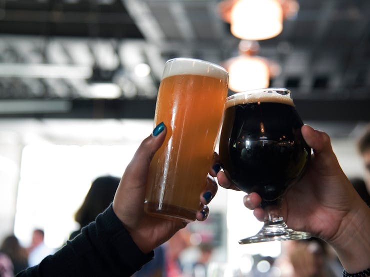 people cheering with beers