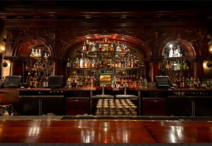 bar made of wood full of drinks