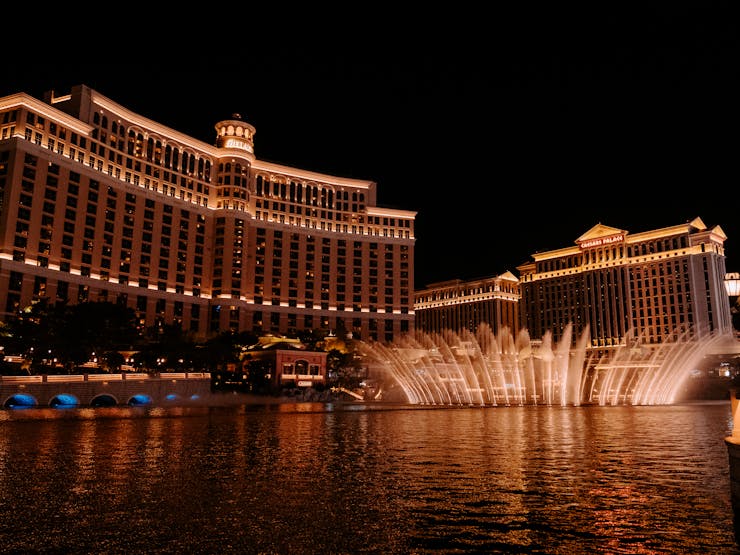 Caesars Palace and the Bellagio fountains at night