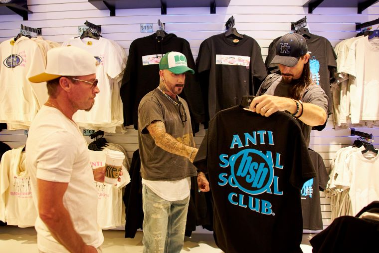 members of the Backstreet Boys checking out merch