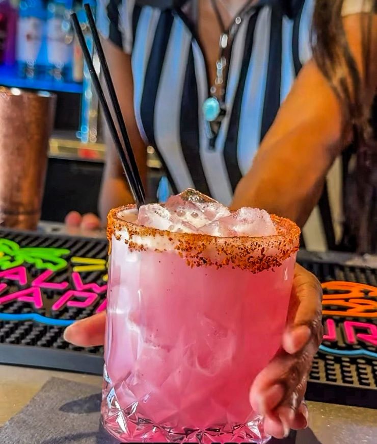 pink cocktail on a bar