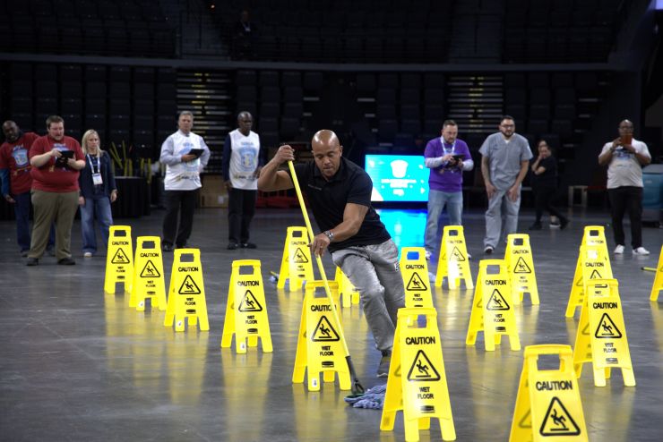 man with a mop at housekeeping Olympics