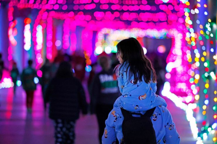 little girl through holiday display