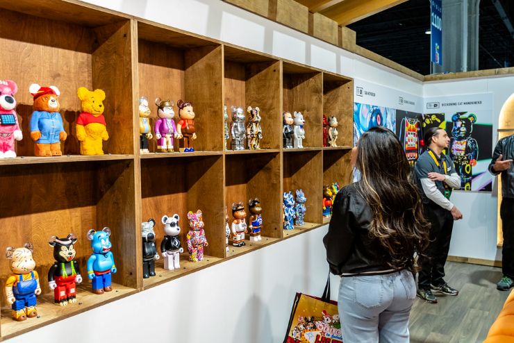 person looking at collectible toys at DesignerCom