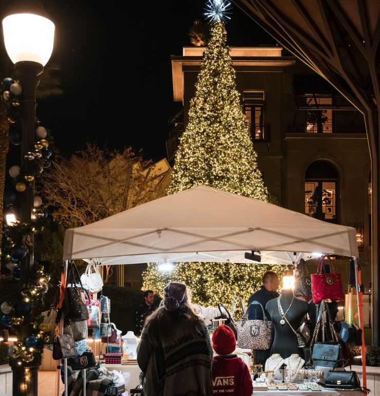 people looking at Christmas tree