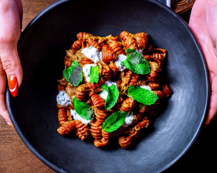 a bowl of pasta with red sauce at Esther's Kitchen