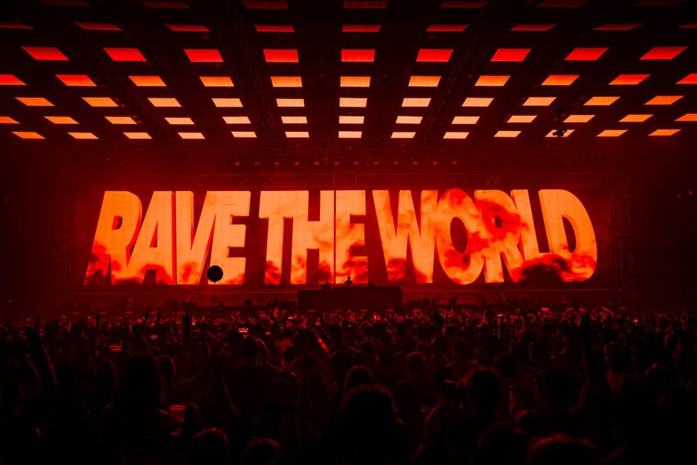 message at Tomorrowland festival saying rave the world