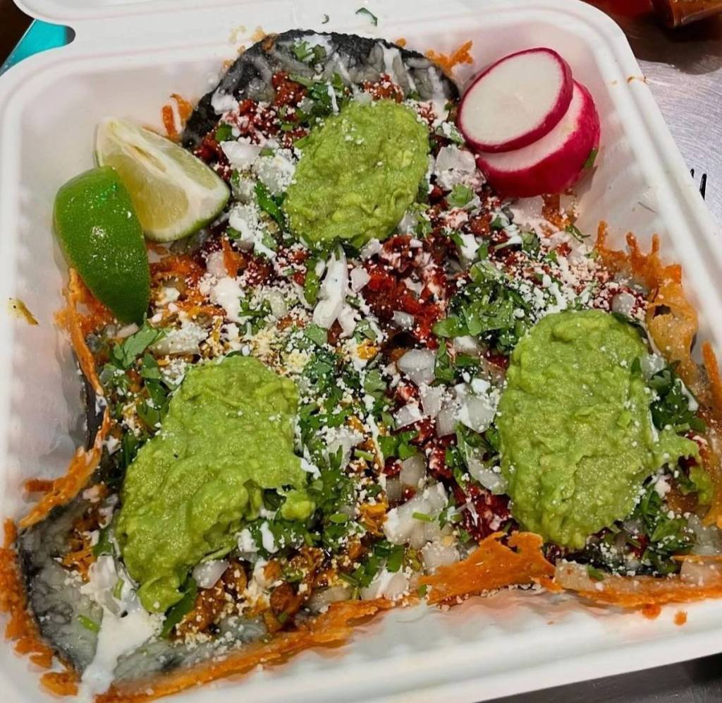 close up of tacos with toppings