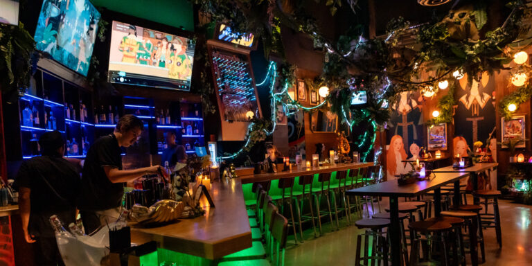 inside a neon Japanese themed bar
