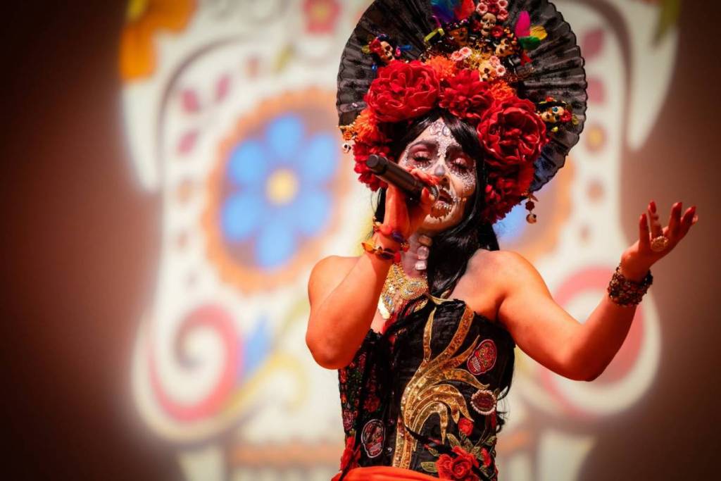 woman performing at Dia de los Muertos event
