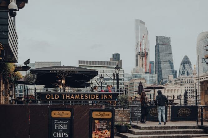 The skyline of London and the exterior of the Old Thameside Inn
