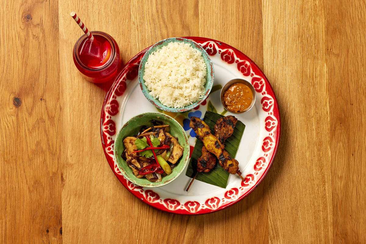 a set lunch from rosas thai with a drink and three menu items on a plate