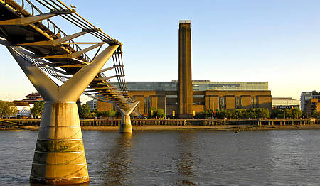 View of the Tate from under Millennium Bridge on the River Thames in. London.