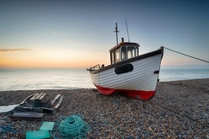 A fishing boat on the beach in Dungeness in Kent