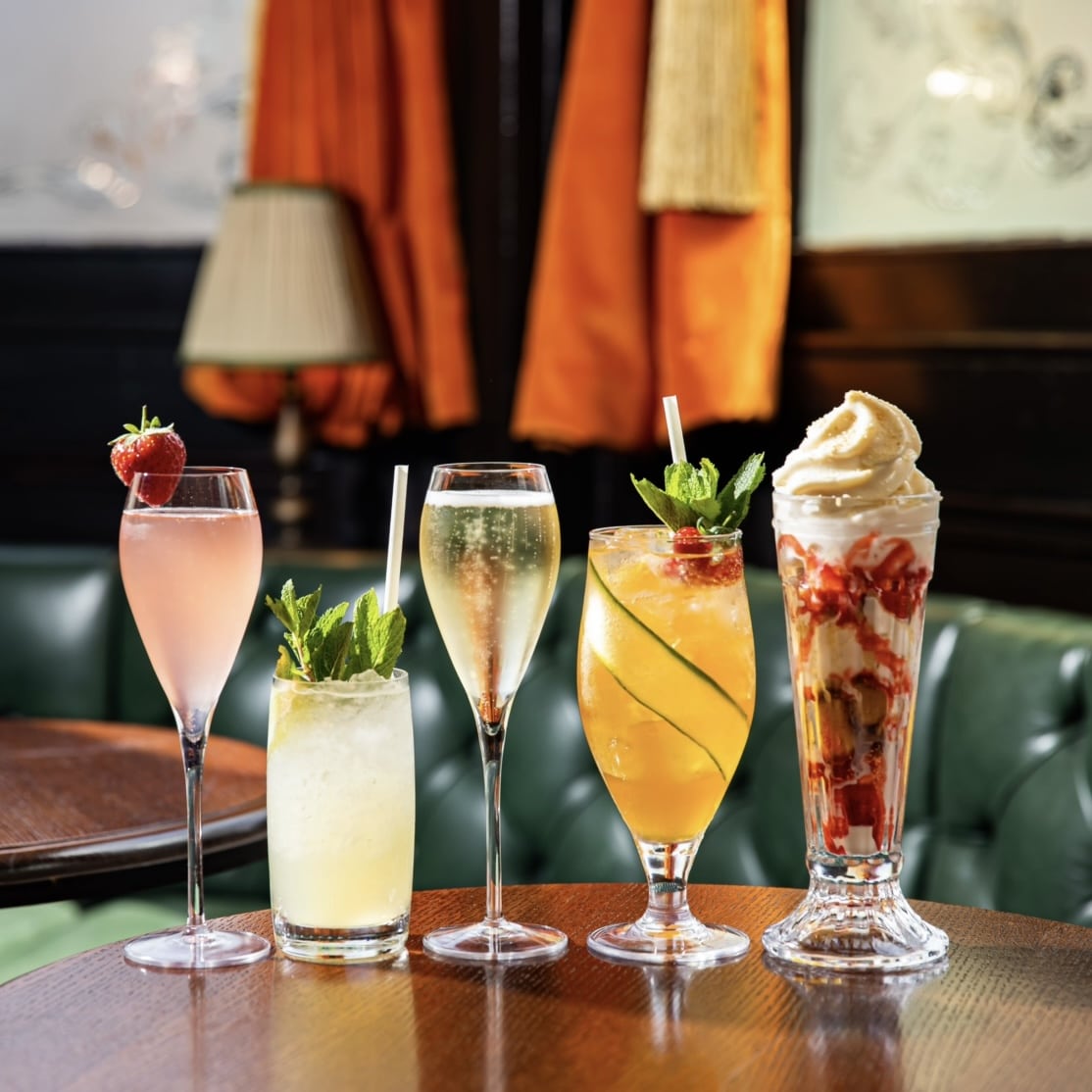 Five different cocktails in different glasses