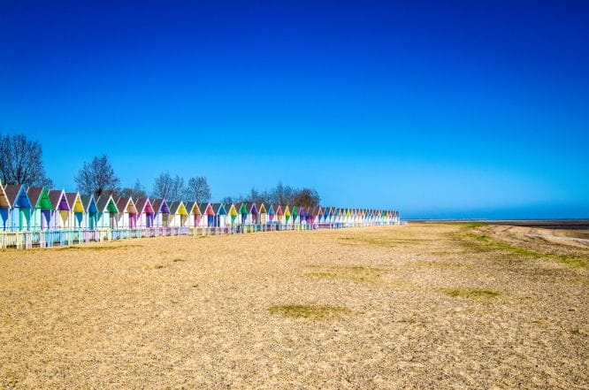 The famous beach huts at Mersea Island in Essex, one of the beaches near London in this roundup