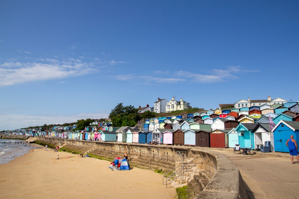 Colourful beach huts and a sandy beach at Walton on the Naze