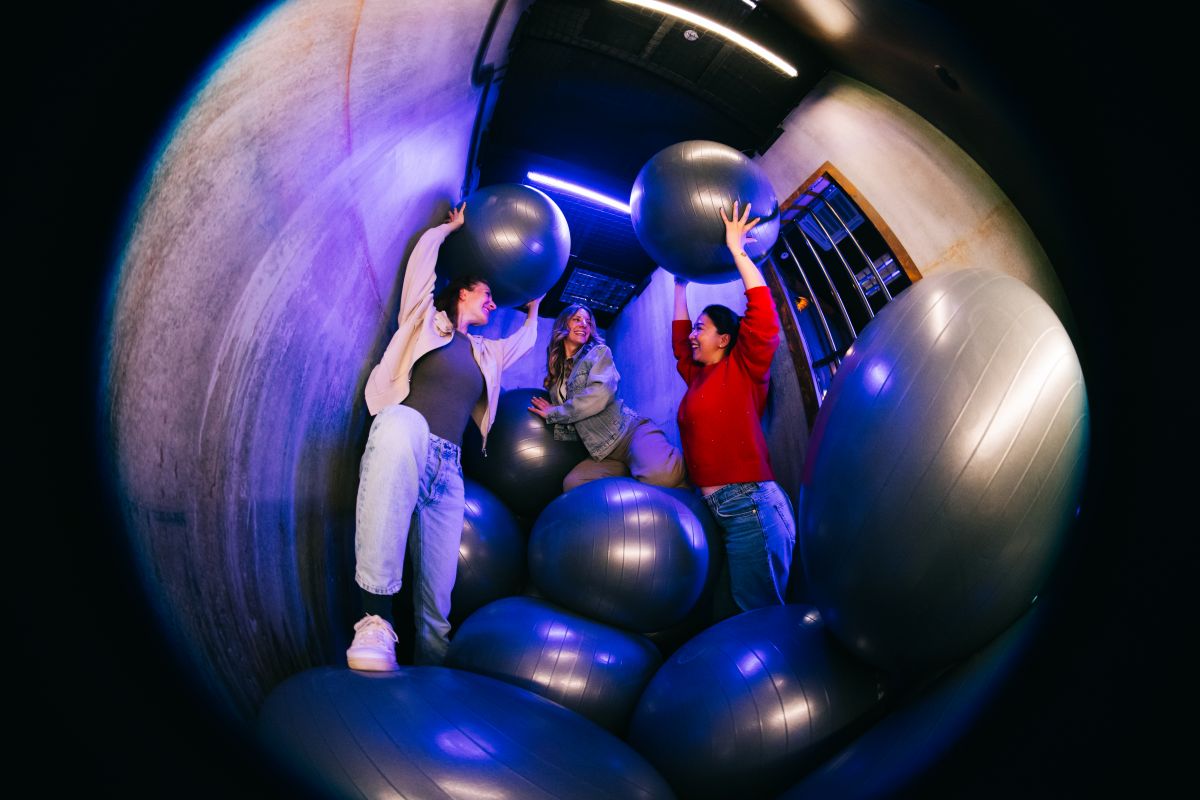 Team of people playing an action game challenge