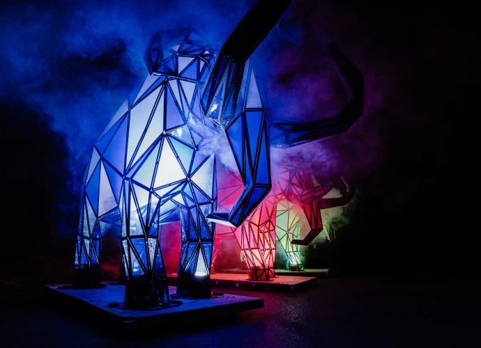lit up giant mammoth installations surrounded by smoke, which will feature as part of the Canary Wharf Winter Lights festival