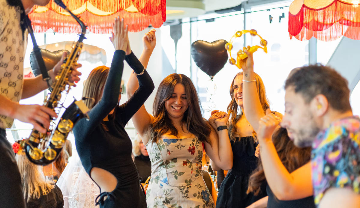 a group of people dancing while enjoying bottomless brunch at the palm house restaurant