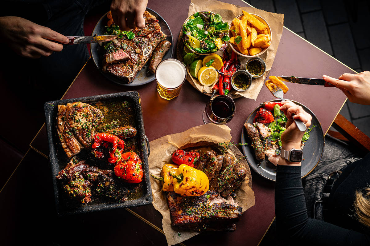 a spread of BBQ brunch dishes from temper laid out on a table
