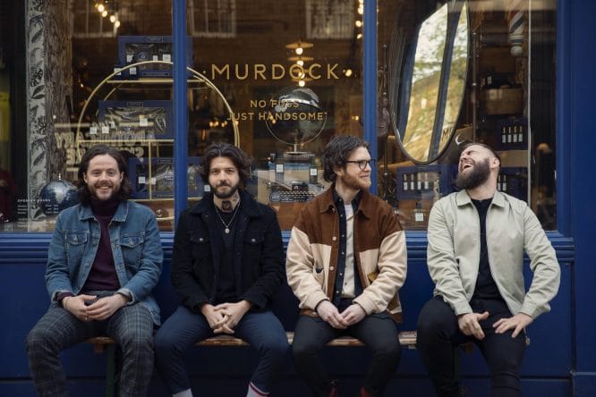 A team of barbers sitting outside Murdock in London