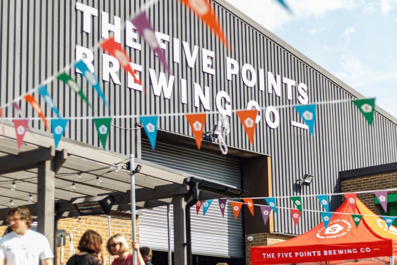 exterior of the five points brewing co brewery and taproom, colourful bunting is strung up