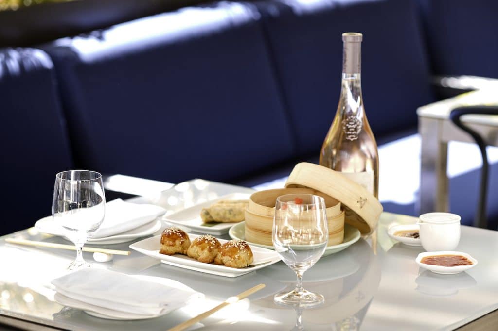 venison puffs on the table at Yauatcha, next to wine and dim sum