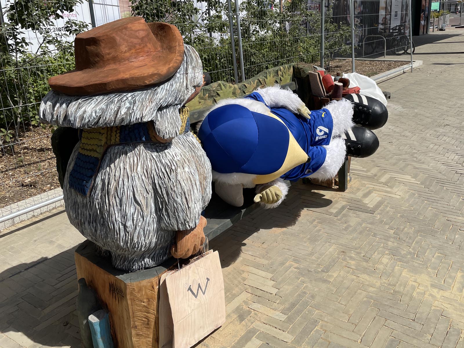 A womble lying on the Orinoco Womble Bench