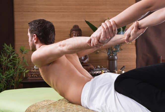 A picture of a man getting a massage at one of the best places for Thai massage in London