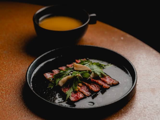 A place of delicious wagyu tataki with a side of broth served at Sachi in Pantechnicon