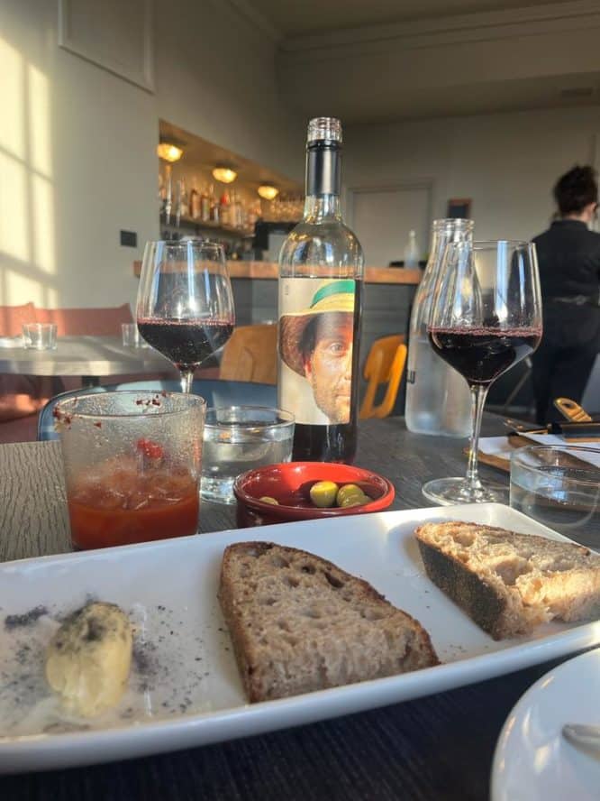 The starter of sourdough bread and butter as well as a 'Proud Mary' and wine served at the Hicce Hart
