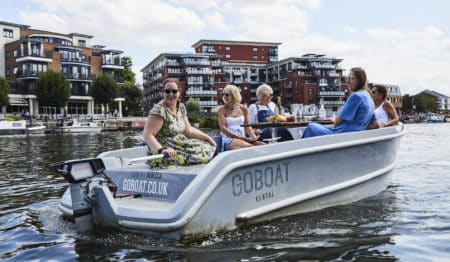 A group of friends on a GoBoat in Kingston, one of the best outdoor activities in London