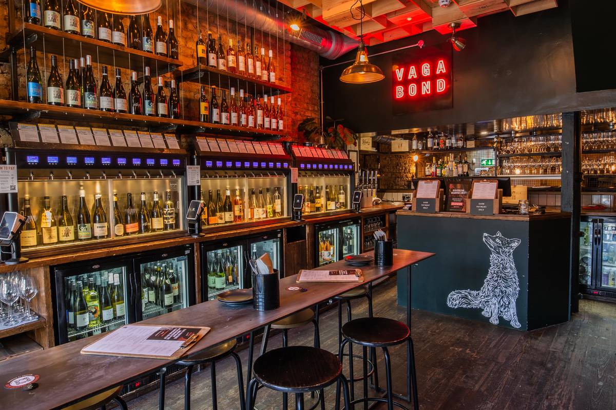 The interior of Vagabond Wines with self serve wine machines lining the walls