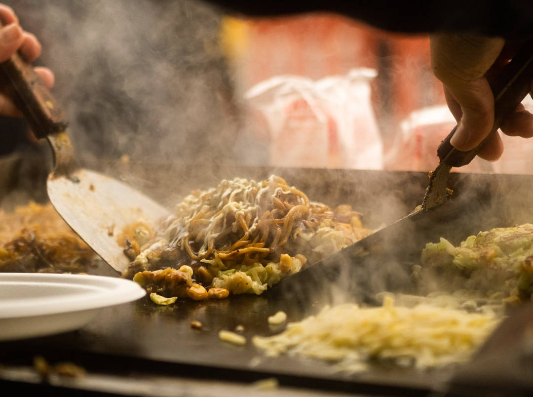 Some steaming Japanese street food being served