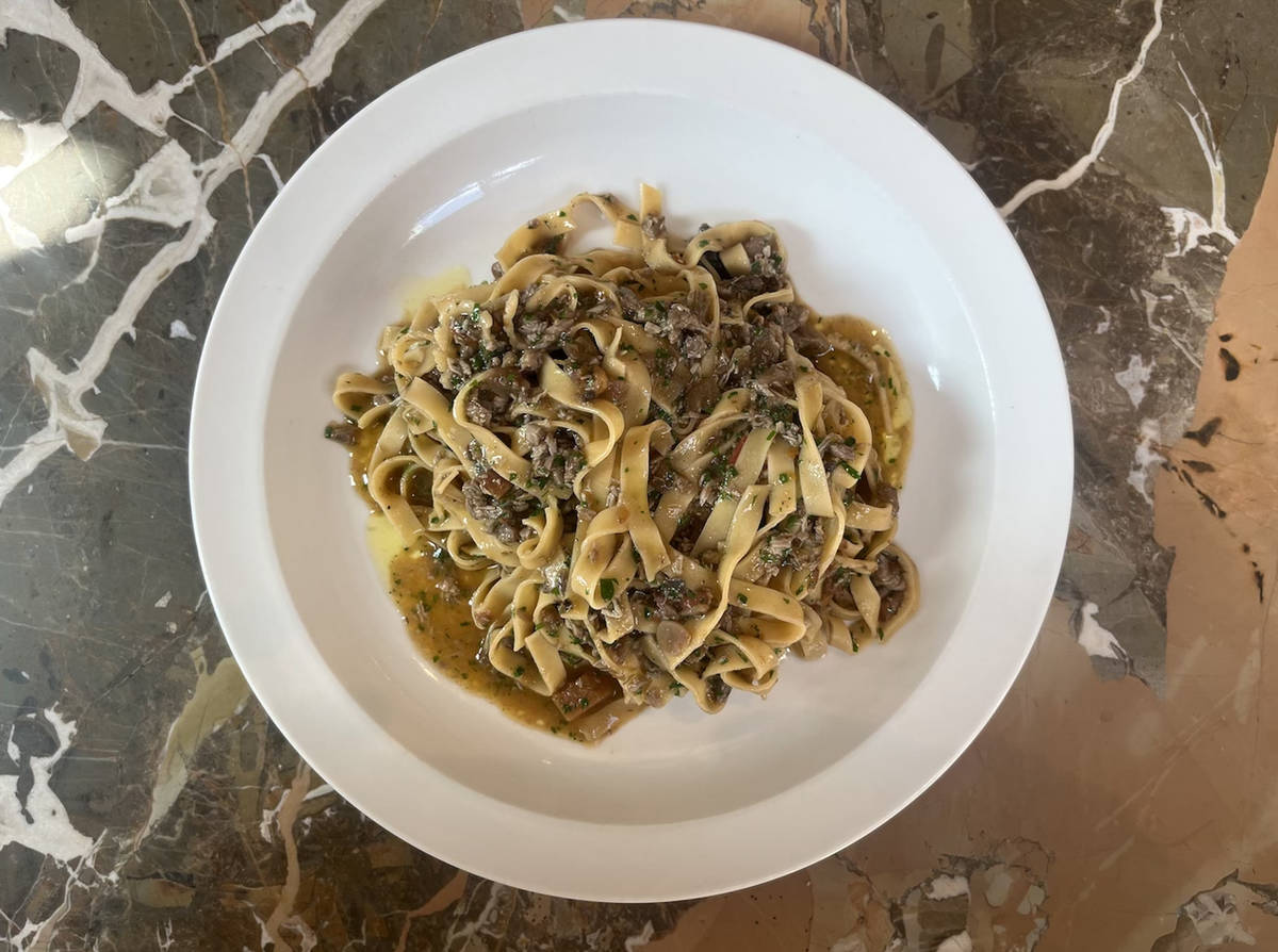 a plate of pasta in a meaty sauce as part of Padella's game menu