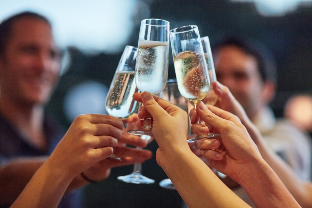 People toasting prosecco.