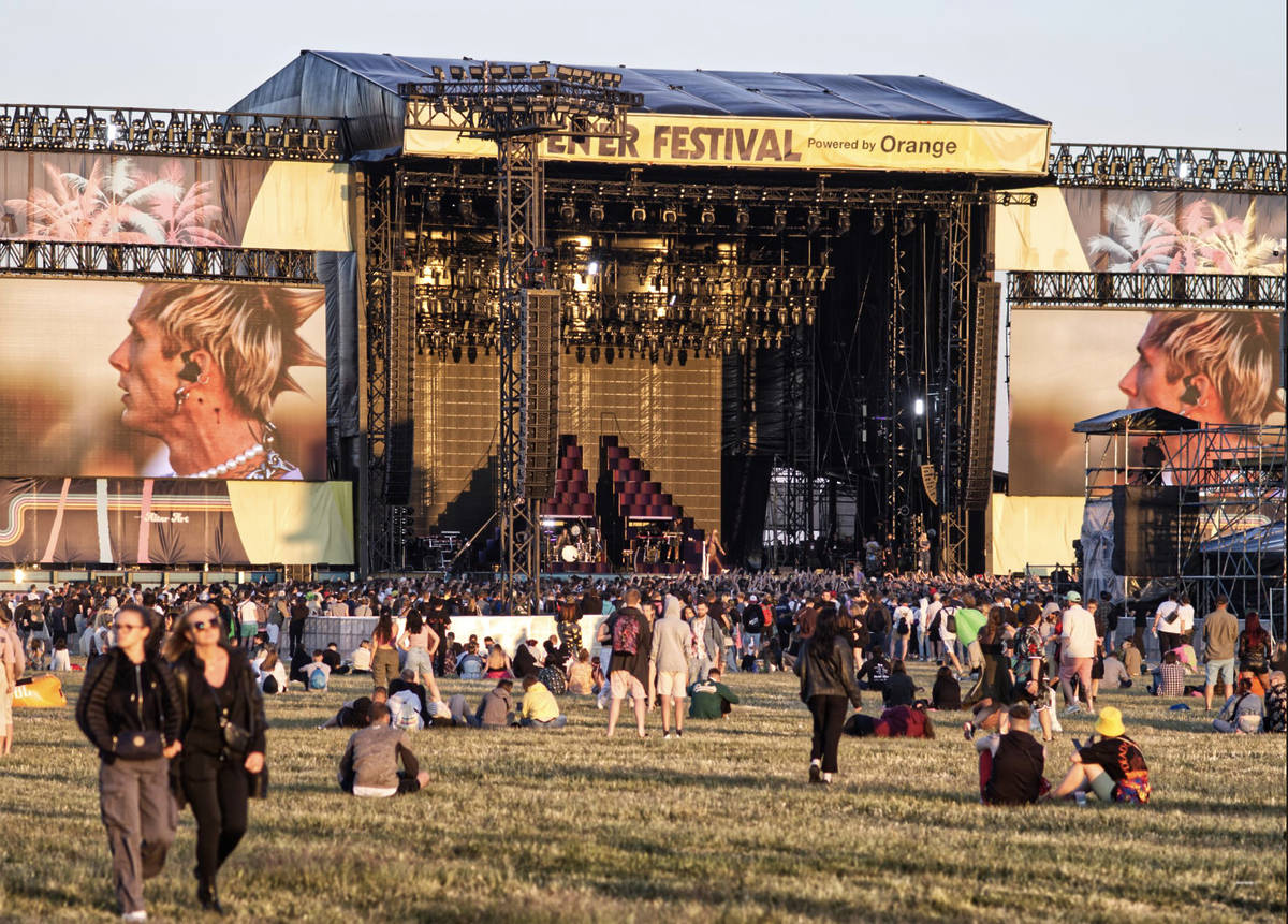 People seen standing and sitting down in front of the stage at Opener festival during a performance