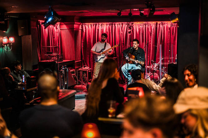 Music performance taking place on stage at Greek Street Live in Soho, London.