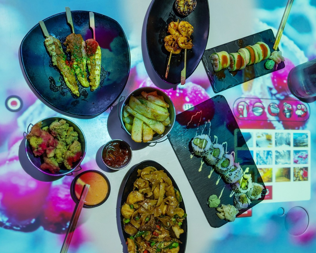 Selection of Pan-Asian dishes on the interactive tables at Inamo in London