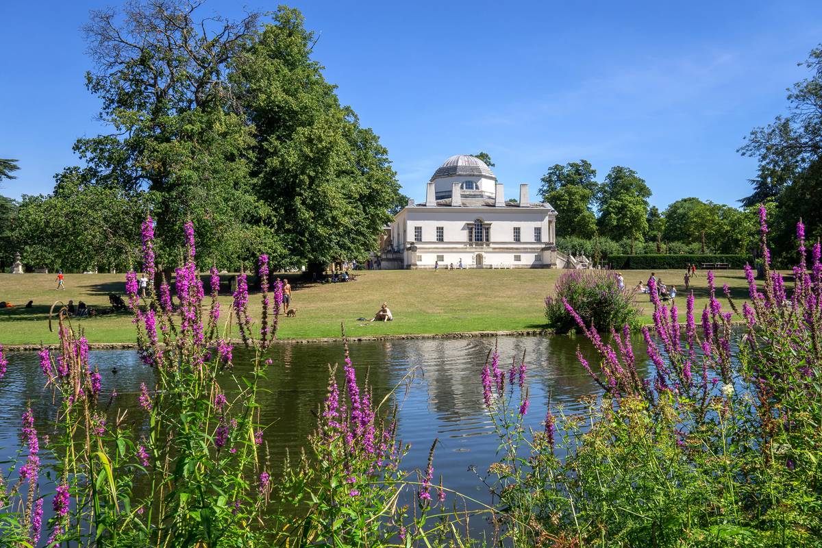 The exterior of Chiswick house across a pond
