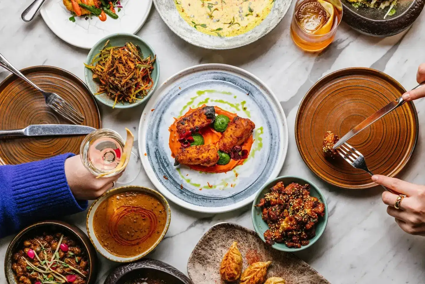 an array of indian dishes served at farzi