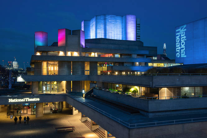 Exterior to London's iconic National Theatre, lit up in the evening
