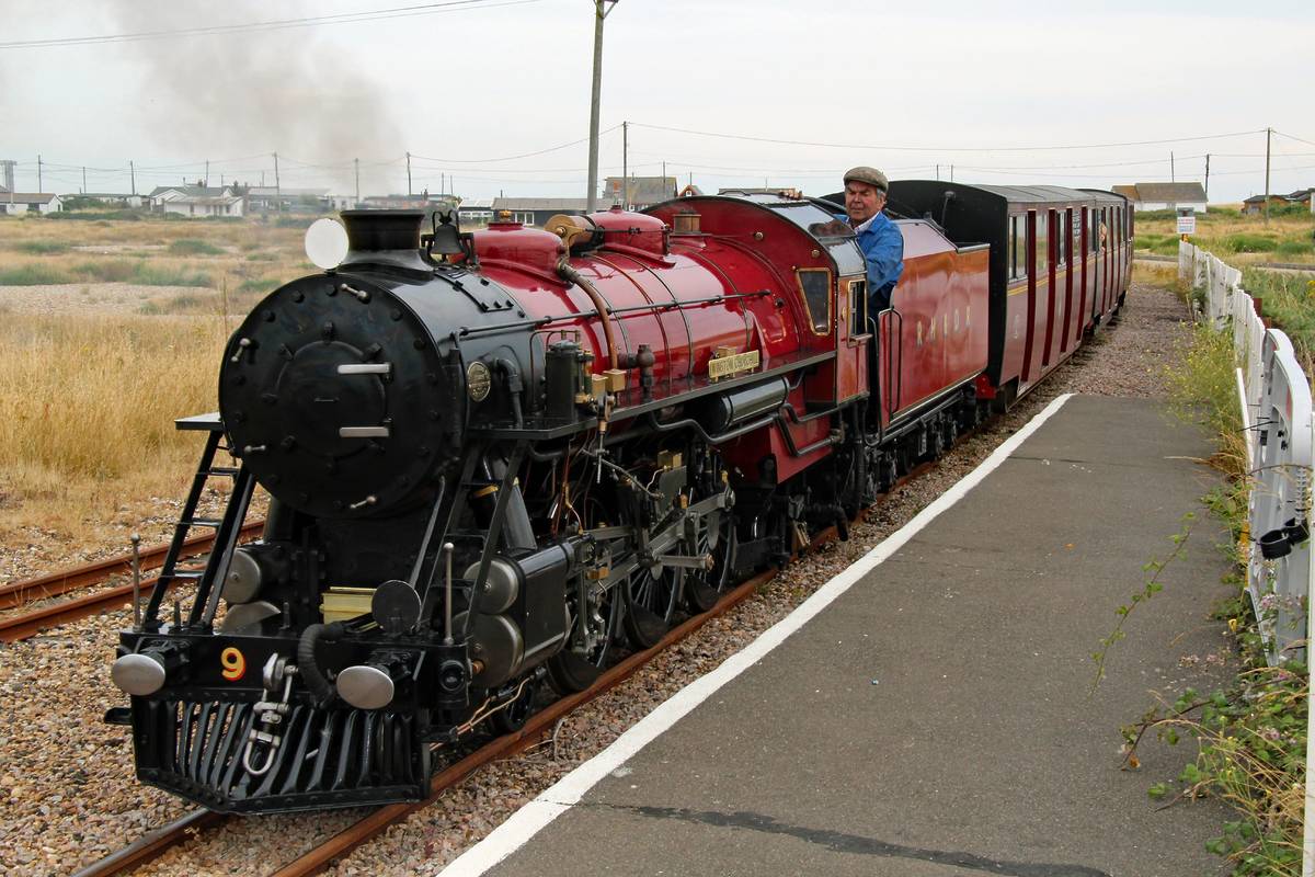 A red steam train on the Romney, Hythe and Dymchurch miniature railway