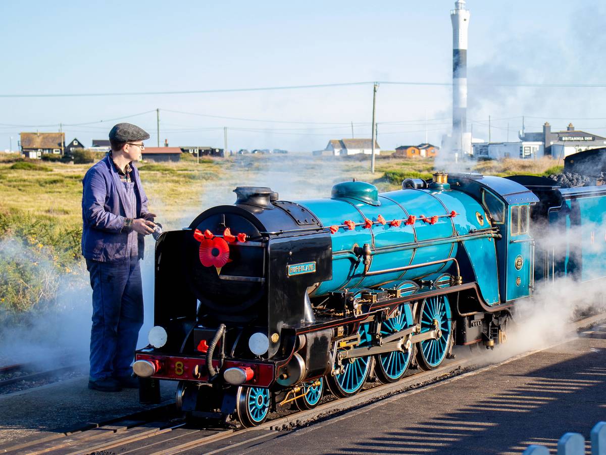 an engineer tends the steam engine on the Romney, Hythe and Dymchurch Light Railway