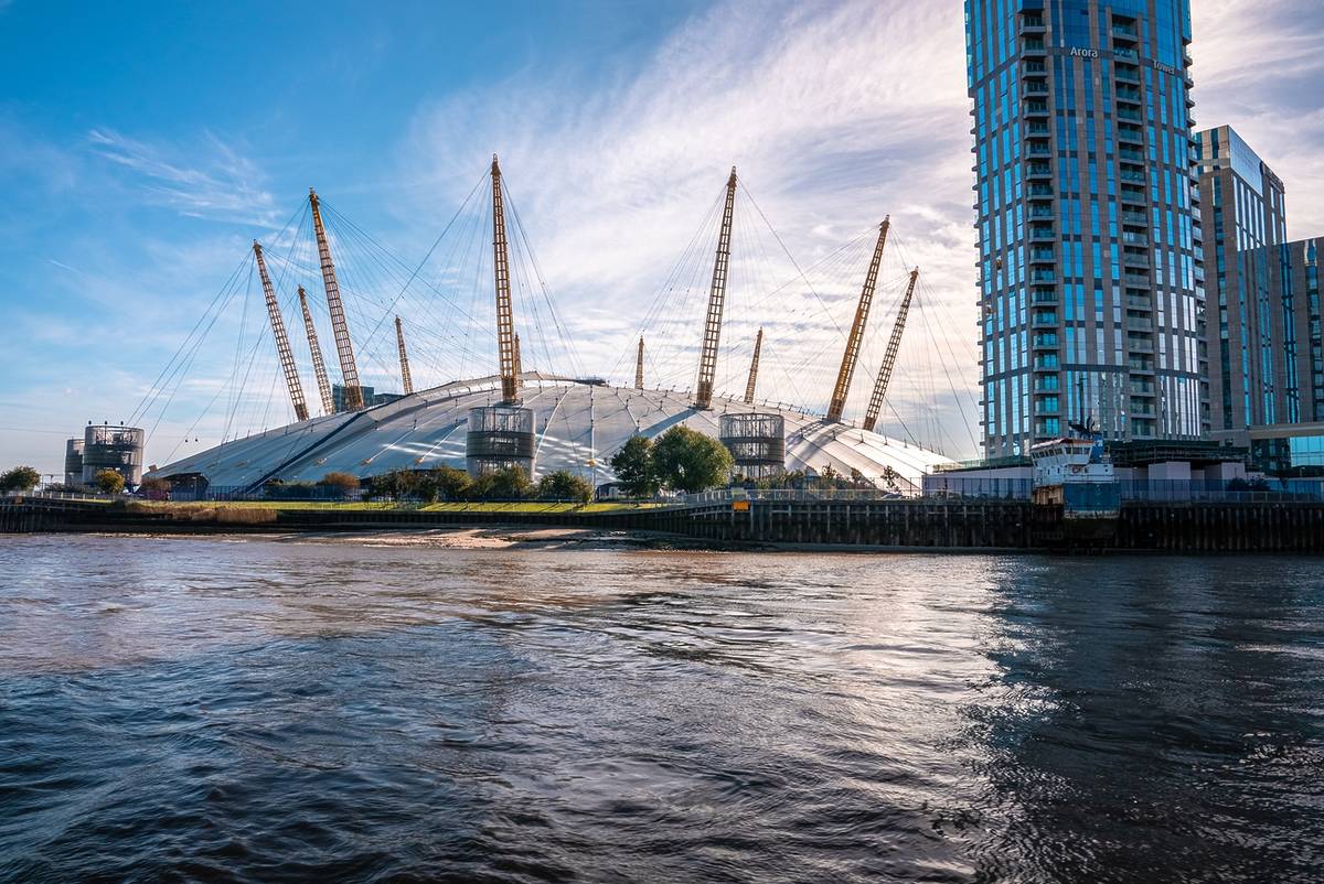 View from the river Thames over Millennium dome or O2 Arena in London, UK.