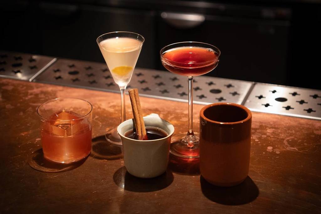 a selection of cocktails on the bar at Soho's Kamara