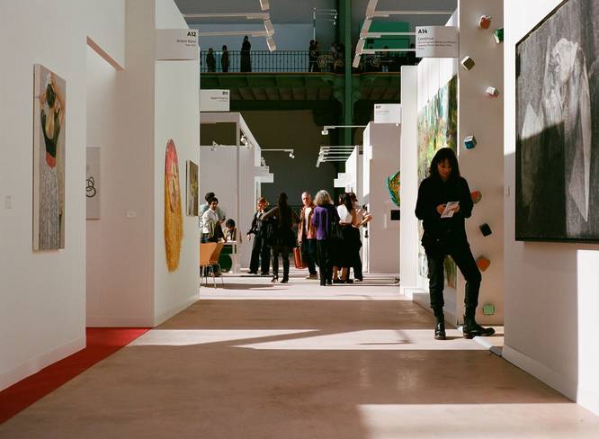 One of the exhibition corridors at Art Basel Paris, with a few visitors