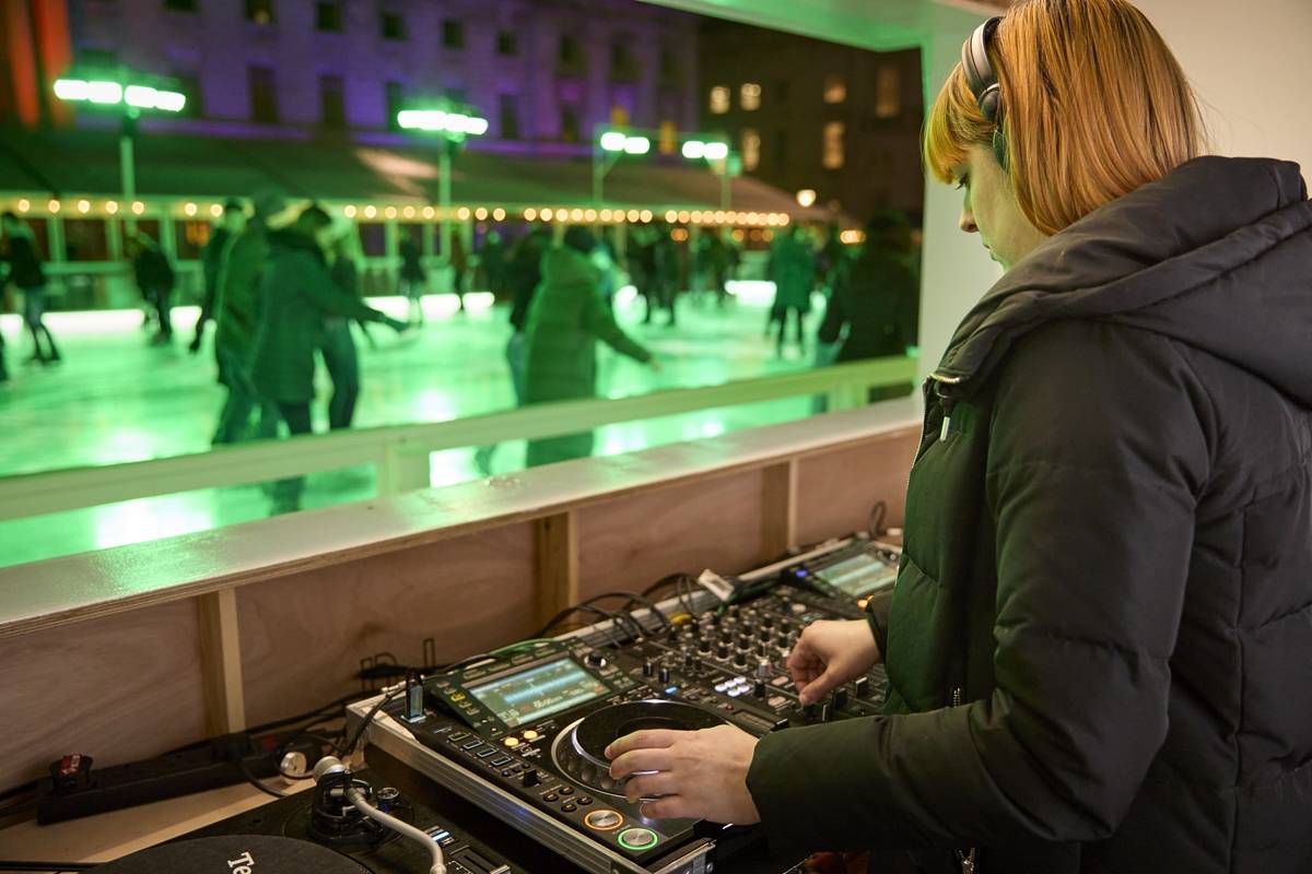 A DJ playing at a Skate Lates event at Somerset House ice rink